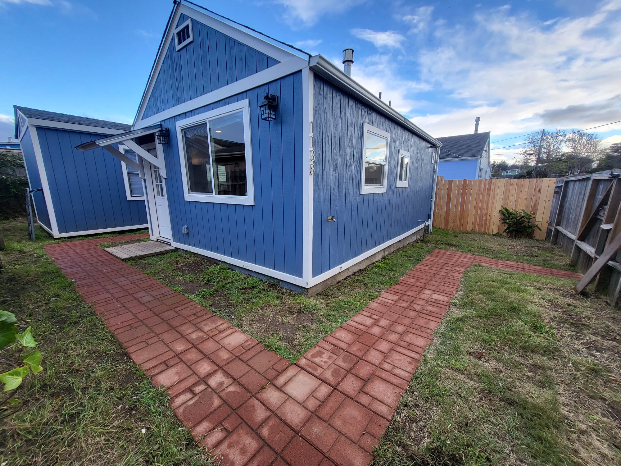 Recently completed exterior with new windows and clean siding finish