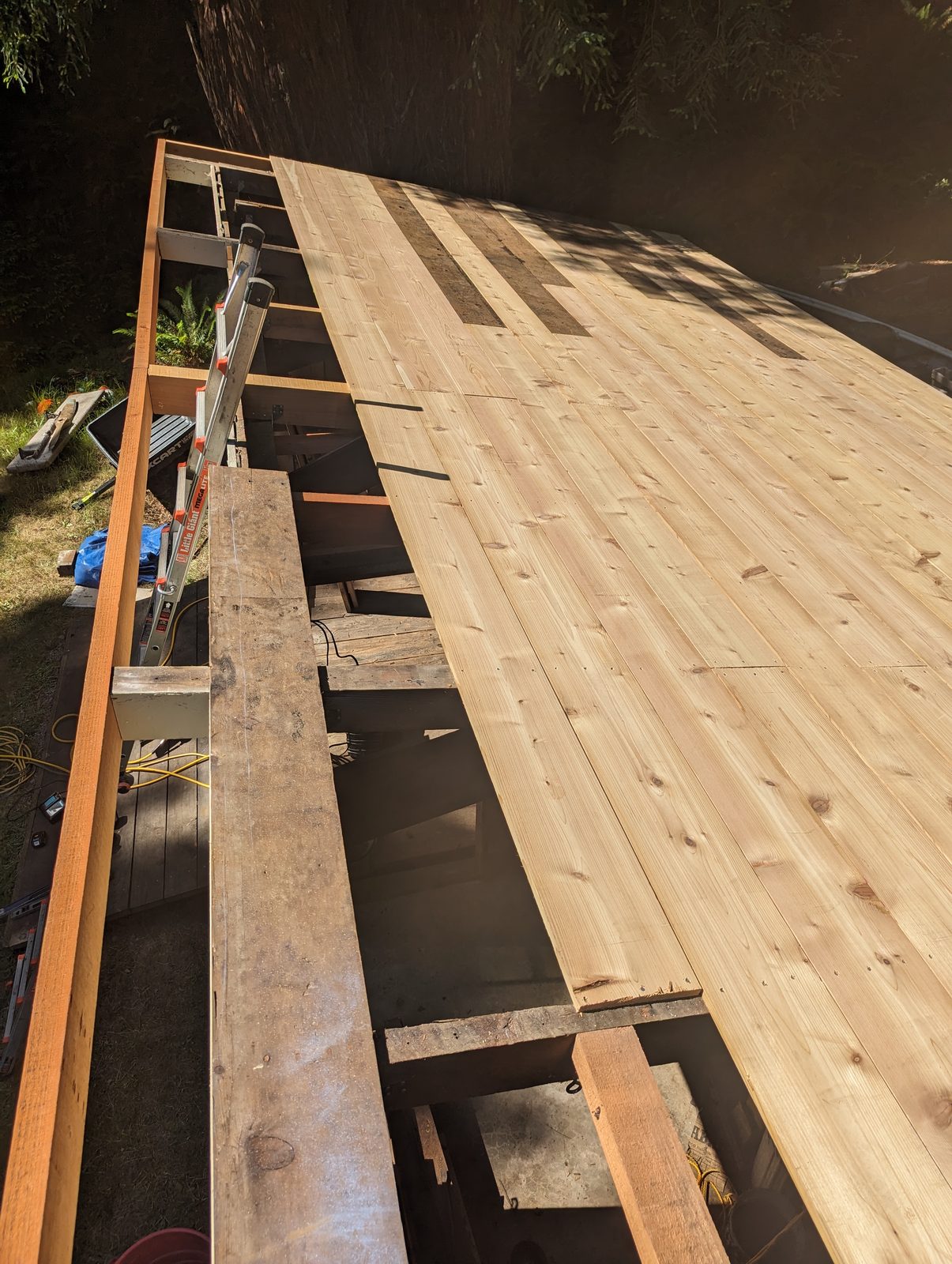 New deck boards going down during a NorCal Exterior deck restoration, replacing failed surface boards