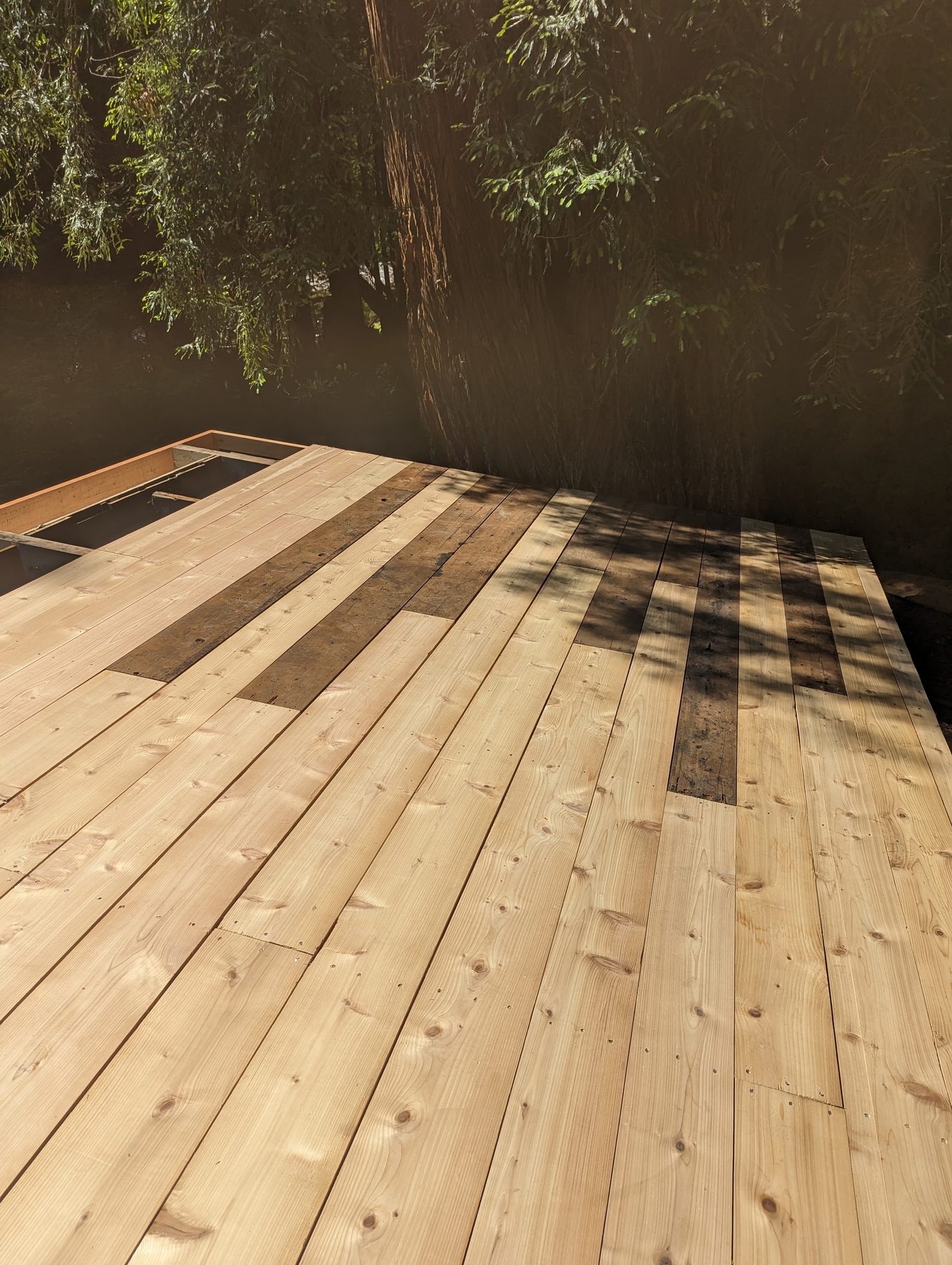 Restored wood deck with new railings and refinished boards by NorCal Exterior in Humboldt County