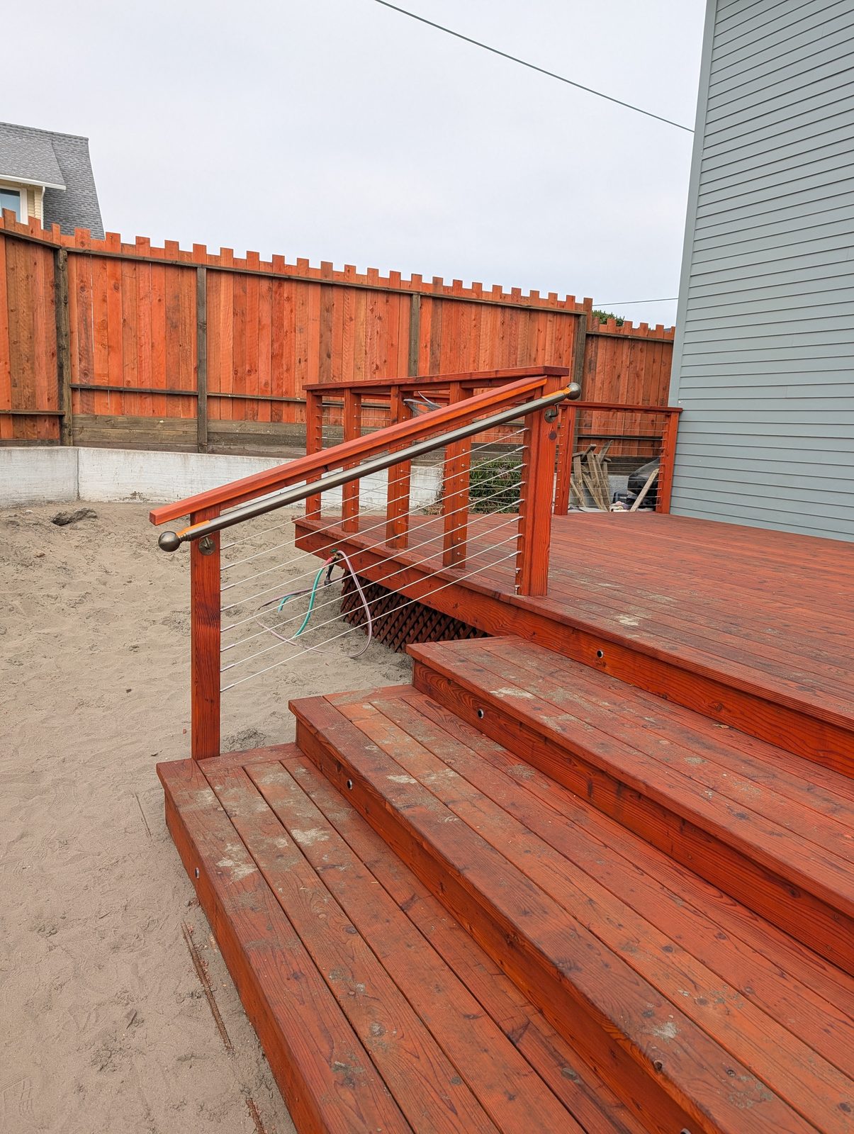 Restored deck with new boards, stairs, and railings on a Humboldt County home by NorCal Exterior
