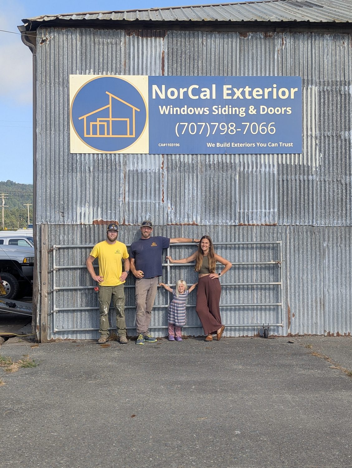 The NorCal Exterior team standing outside the company shop in Arcata, with the branded NorCal Exterior sign on the building