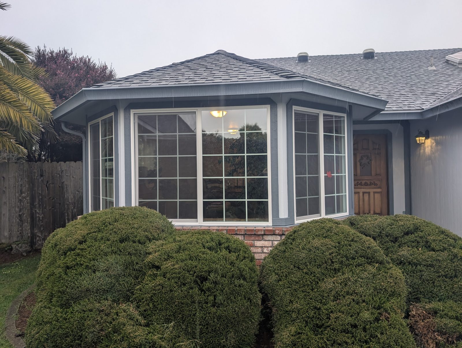 Large bay window with crisp white trim on a Humboldt County home, installed and weatherproofed by NorCal Exterior
